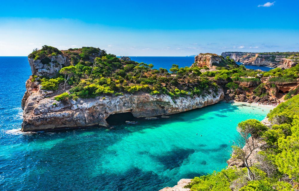 Beautiful beach bay with tropical turquoise water, Cala des Moro, Majorca island, Spain Mediterranean Sea.