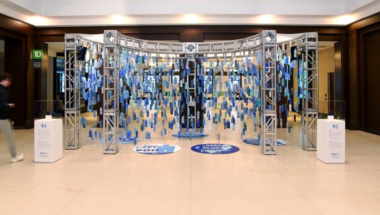 Niagara Now art installation, a 12-foot-high waterfall with painted water bottles hung by fishing line