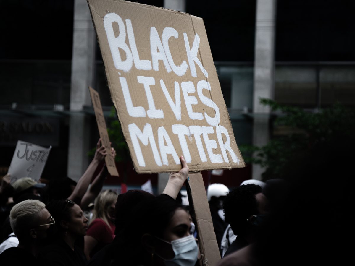 A protestor holds a sign at the Not Another Black Life protest in Toronto on May 30, 2020