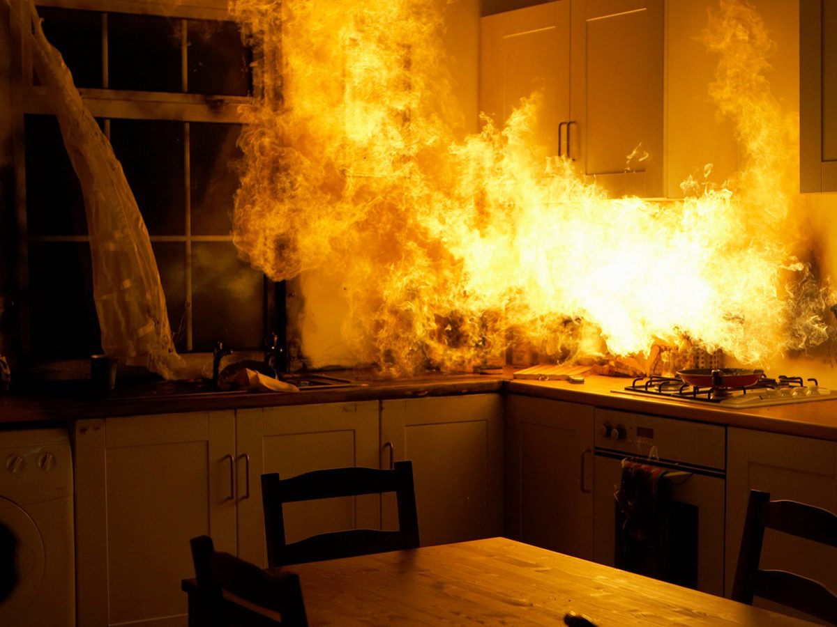 Home fire hazards - Fire raging in domestic kitchen at night